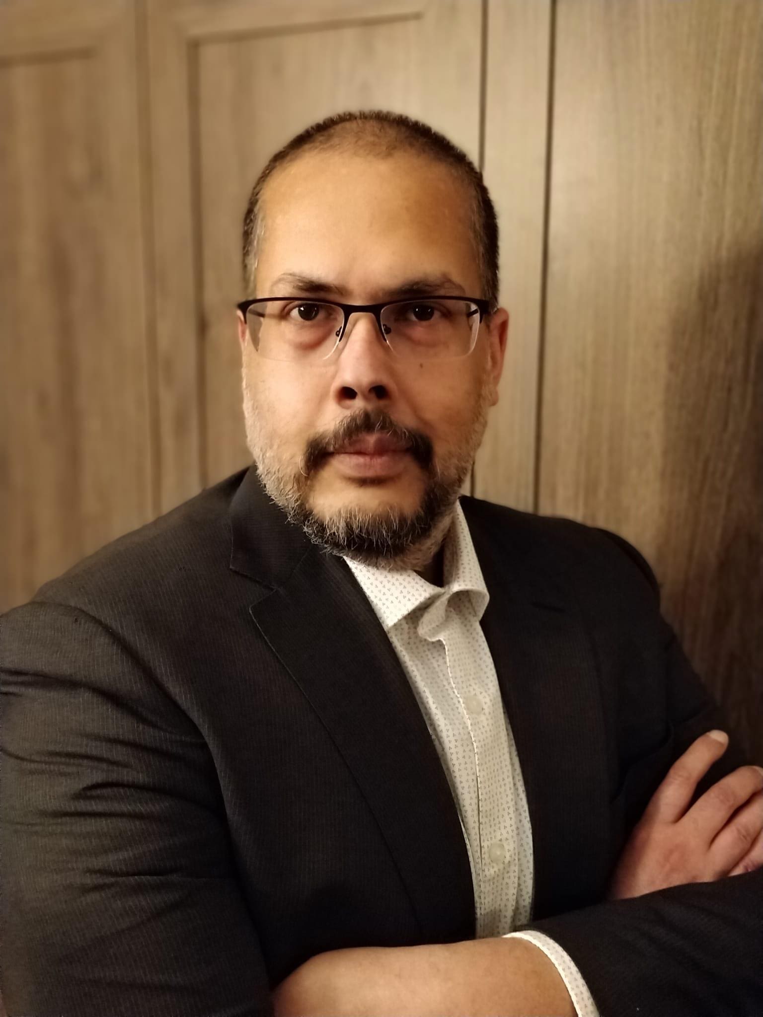 Asurtec professional portrait in suit IT and Data specialist for NFPs